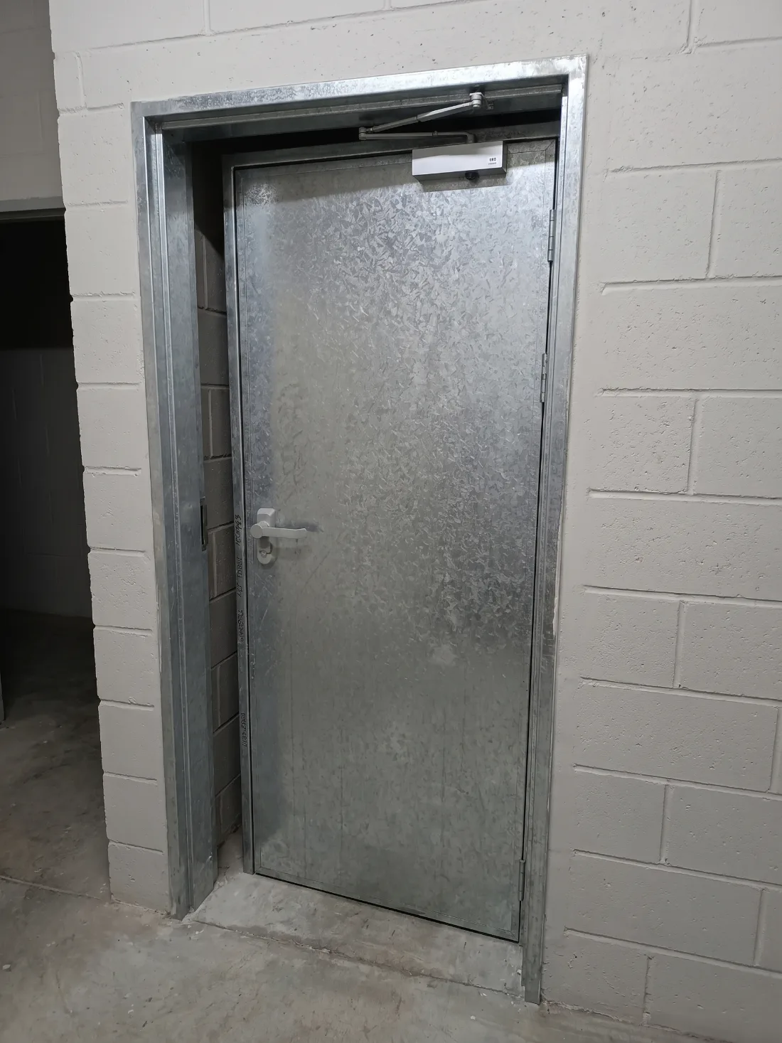 Galvanised fire door installed in a plant room